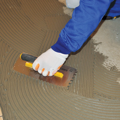 Gletieră zimțată, cu dinți pătrați și mâner deschis din plastic